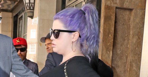 Pregnant Kelly Osbourne looks glamorous as she leaves London hotel with frail dad Ozzy in sea of photographers