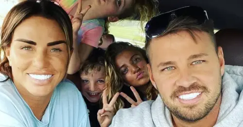 Katie Price's fiancé Carl Woods cheekily likens her lip fillers to a camel as family enjoy day out on safari