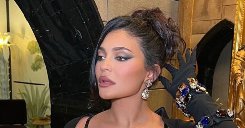 Kylie Jenner exudes glamour in a black corset dress ahead of Kourtney's wedding
