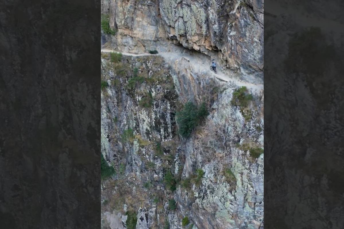 #DontLookDown: Mountain Biker Has No Business on This Cliff
