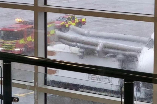 Emergency Slide On Delta Air Lines Boeing 767 Accidentally Deploys On Top of a Catering Truck at Gatwick Airport