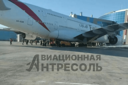 Emirates A380 Superjumbo Badly Damaged in Moscow After Pushback Tug Gets Completely Wedged Underneath Aircraft