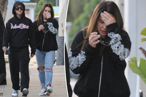 Kyle Richards attempts to hide her face while hanging out with Morgan