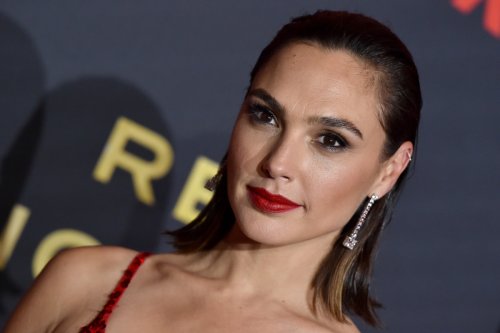 Gal Gadot Rides Her Bike on the Beach in a White Power Suit in New Instagram Photo