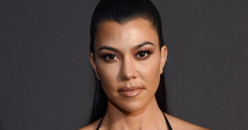 Kourtney Kardashian Lounges in Sultry Black Swimsuit on Boat in Italy