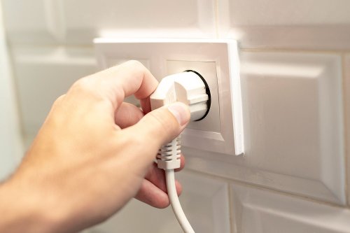 7 Things You Should Always Unplug When You Go on Vacation and 3 Things That Should Stay Plugged in, According to Experts