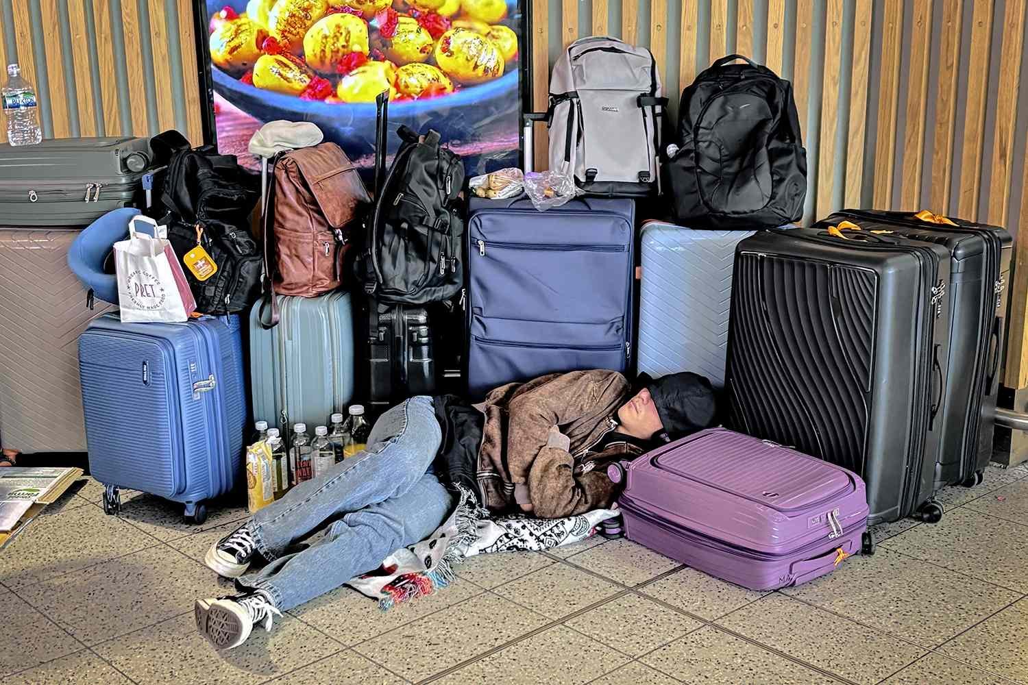 330,000 Travelers Impacted by ‘Horrendous’ Mass Flight Cancellations in U.K., Leaving Many Sleeping on Airport Floor
