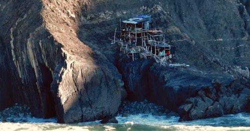 Drone Photographer Discovers Mystery Driftwood Shack Perched on Cliff