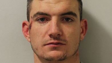Man who rammed police cars and attacked officers jailed
