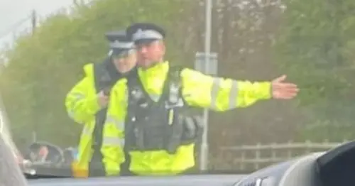 Live: Police and 'raid vans' close main Plymouth road