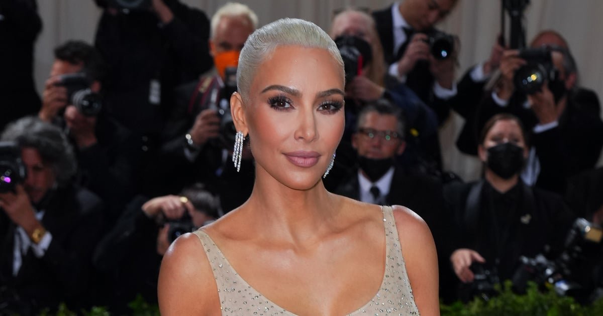Kim Kardashian Struggles to Walk and Climb Stairs in Skintight Chain-Mail Gown