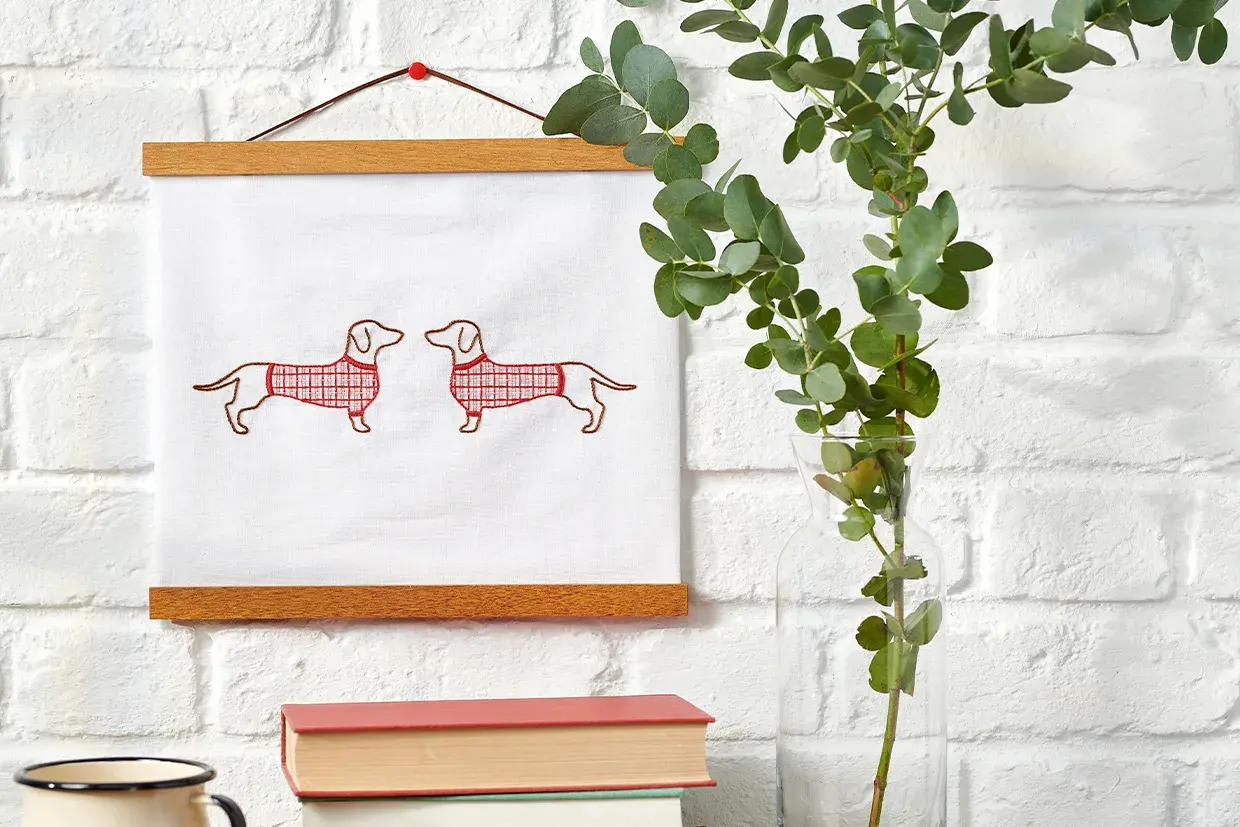Create a festive hanging with this dog embroidery pattern