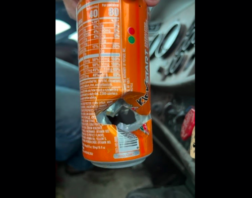Close shave for truck driver: Bullet enters cab, hits Mountain Dew can in cup holder