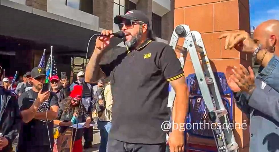 Proud Boys member talks armed revolt outside Giuliani event: 'We're not going to stand back and stand by'