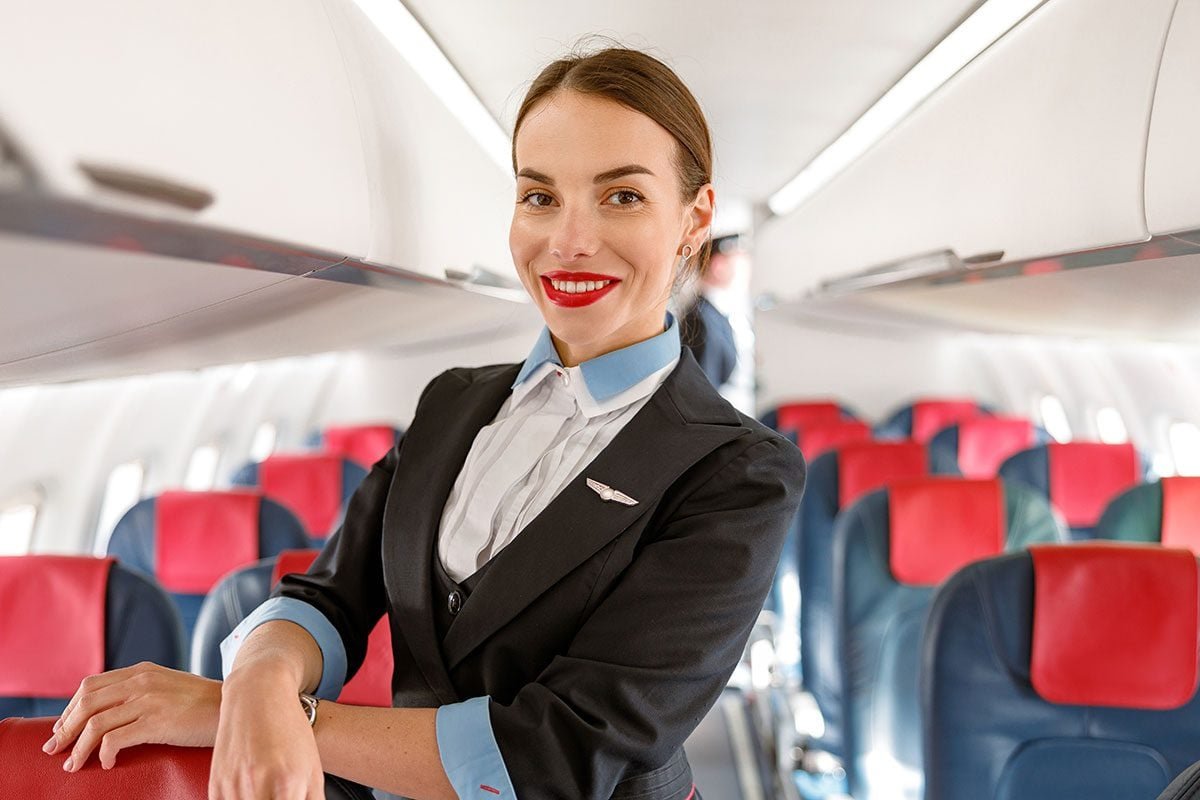 The Surprising Reason Flight Attendants Swear by Red Lipstick