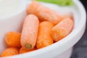 We Finally Know What The White Stuff On Baby Carrots Is