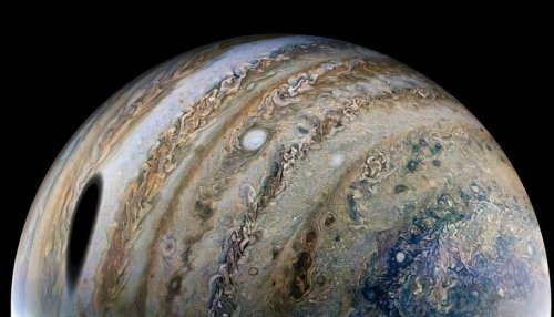 NASA's Juno beams back another stunning Jupiter pic shadowed by its Moon Ganymede