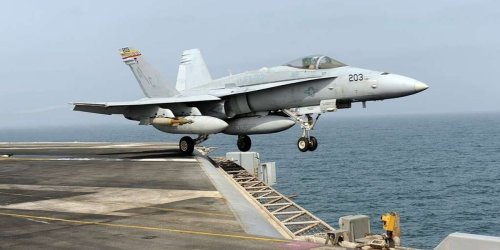 F-18 rolls off US carrier as it turns to avoid Houthi fire
