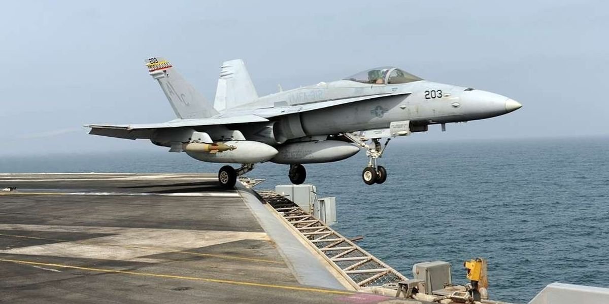 F-18 rolls off US carrier as it turns to avoid Houthi fire