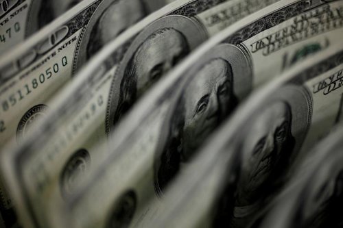 Dollar on track for third weekly gain after strong U.S. payrolls data