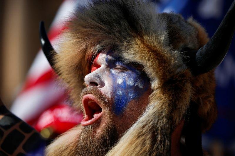Fact check: Man with painted face wearing fur and horns rallied for Trump and QAnon, not Antifa or BLM