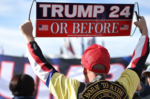 They're Too Extreme for QAnon -- and Right at Home at Trump's Rally