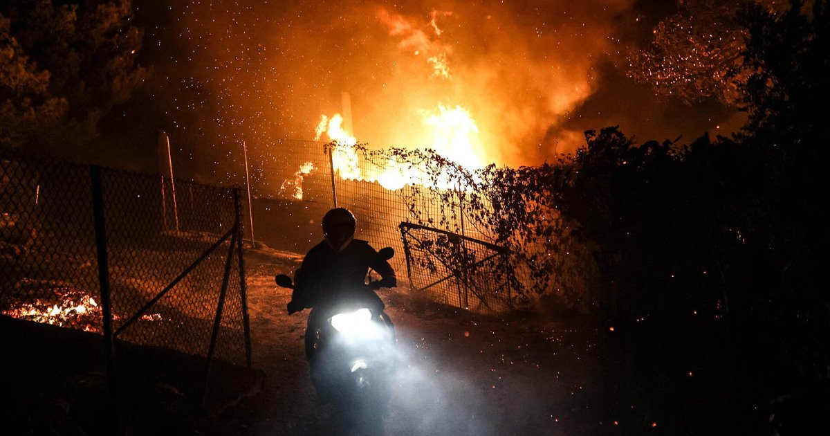 Wildfires sweep through hillside suburbs north of Athens, Greece