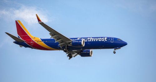 Southwest Airlines passenger hospitalized after opening emergency exit and climbing onto wing, officials say