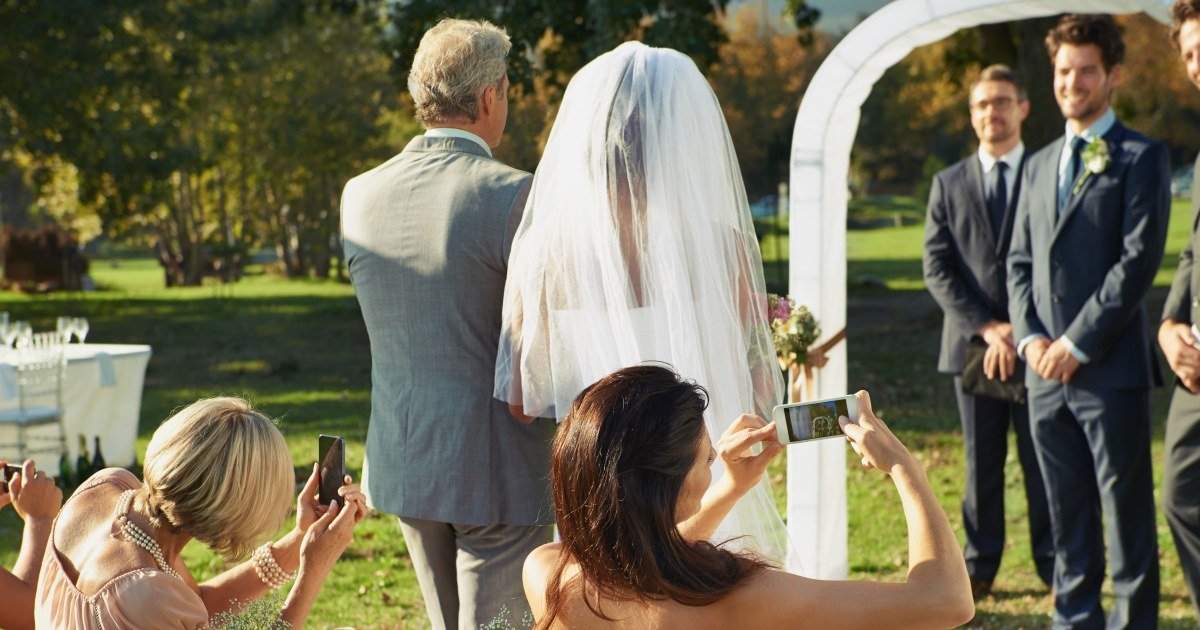 Rude or just recording? The internet is heated over wedding guests' cellphone faux pas