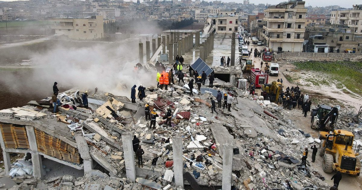 Drone footage shows rescuers dig through mountain of rubble in northern Syria