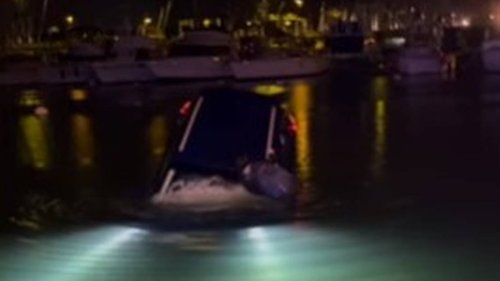 Tourist following GPS directions drives into ocean at harbor, Hawaii