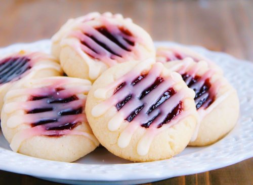 Win the holiday baking swap with this new spirited take on classic raspberry thumbprint cookies
