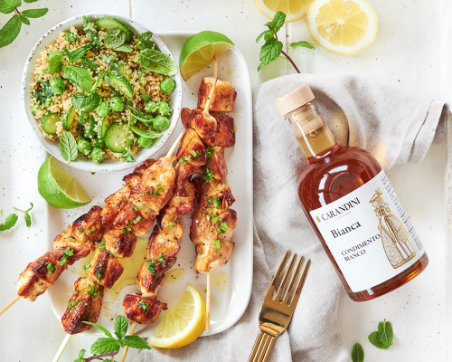 Sweet white vinegar and parsley are the keys to these lemony grilled chicken skewers