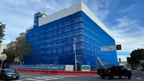 The tallest building in downtown SLO is wrapped in blue. What’s happening?
