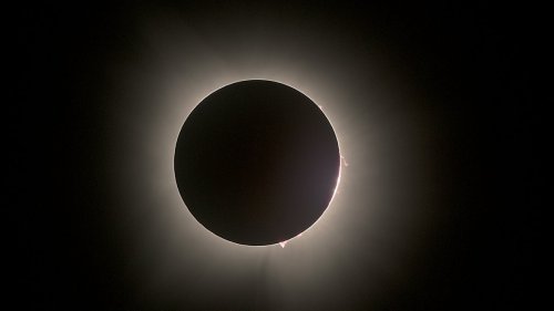 Red Dots around Total Solar Eclipse Explained