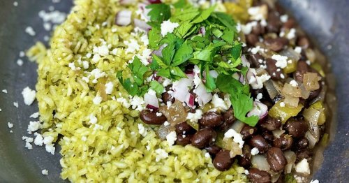 Cooked with a flavorful green sauce, green rice and Cuban-style black beans hits the spot