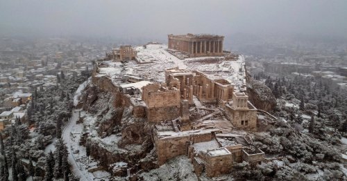 Surreal photos show Athens' ruins and beaches blanketed in snow, again