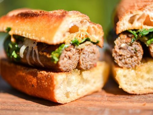 Grilled Merguez Sandwiches With Caramelized Onions, Manchego, and Harissa Mayonnaise Recipe