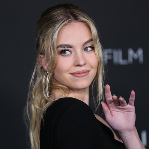 Sydney Sweeney Wows In A Black Skintight Top, Mini Skirt, And Sheer 