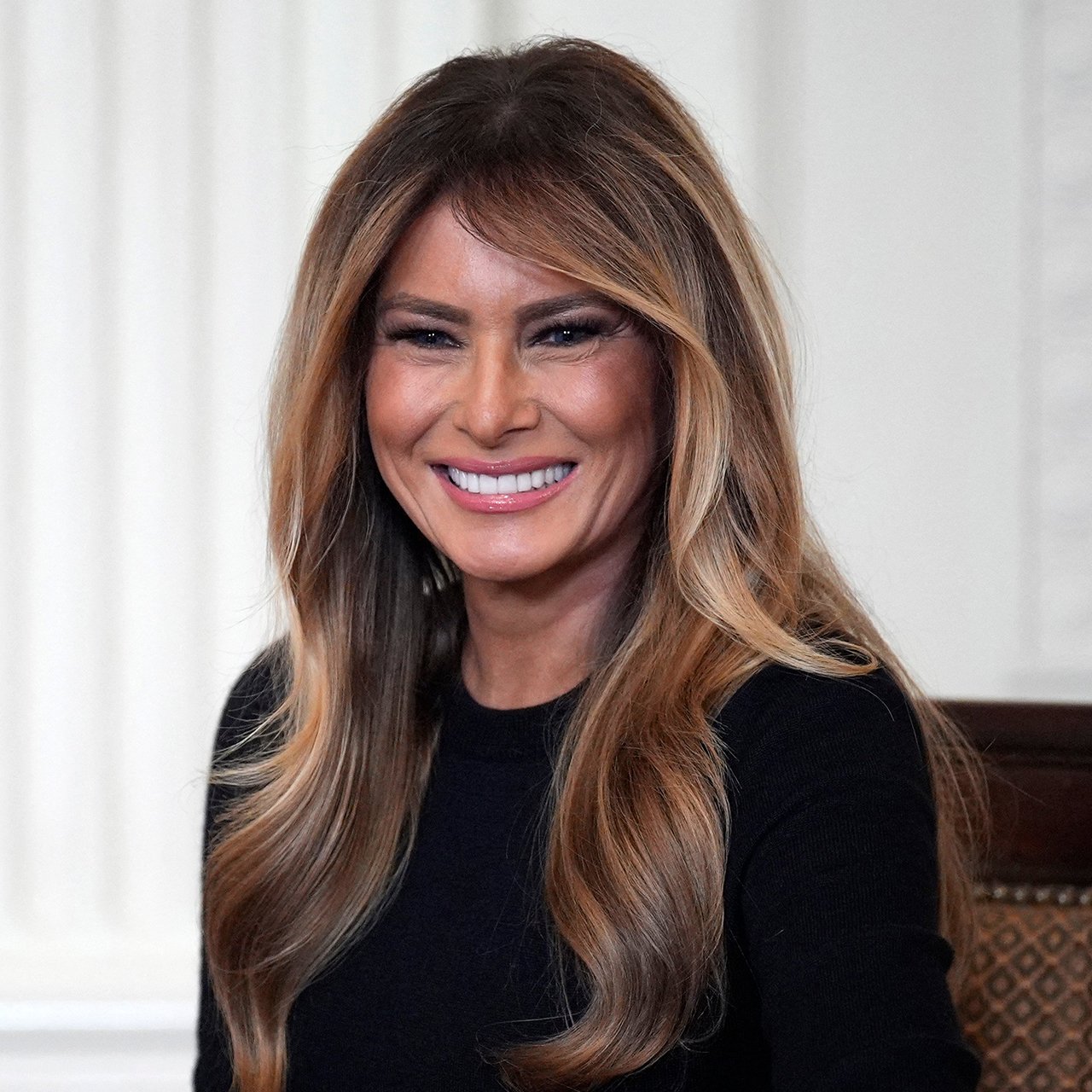 Melania Trump Called The 'Most Stunning First Lady' While Wearing A Red Pencil Skirt & Blue Shirt At 'Fostering The Futu