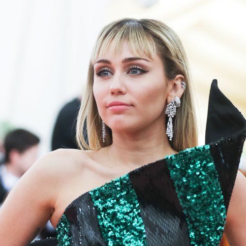 Miley Cyrus Rocks A Micro-Mini Dress At The BRIT Awards Amid Messy Family Drama