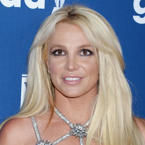 Britney Spears Steps Out For The First Time After Bombshell Memoir Release In Figure-Hugging Orange Dress