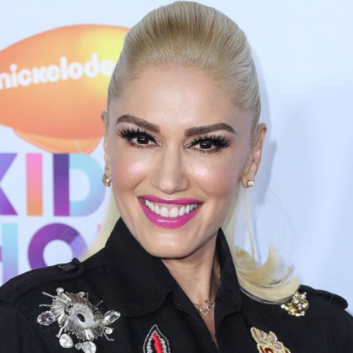 ‘The Voice’ Fans Can’t Get Enough Of Gwen Stefani’s Checkered Bralette And Fishnet Tights Look From Her Indycar Performance