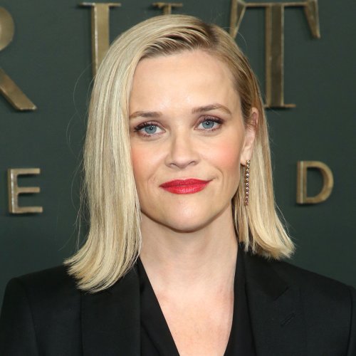 Reese Witherspoon Puts On A Leggy Display In A Red Dress And Heels For Her Latest Netflix Drop