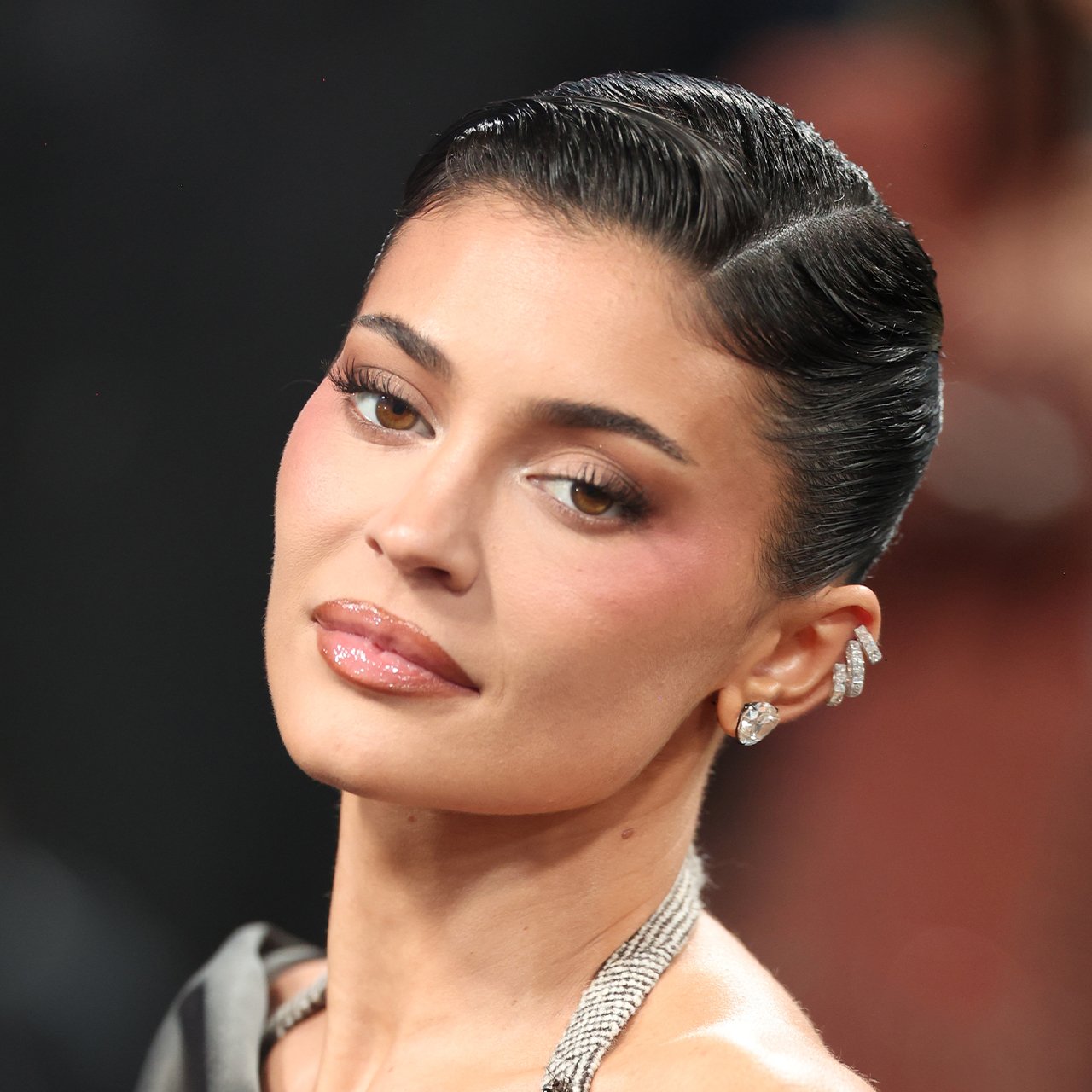 Fans React To Kylie Jenner's 'Frozen' Facial Expression In Viral Photo While Smiling During Friend's Wedding: 'It's The