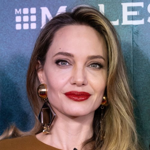 Angelina Jolie Is A Vision At 'The Outsiders' Premiere In A Satin Gown And Cape: 'Always A Goddess'