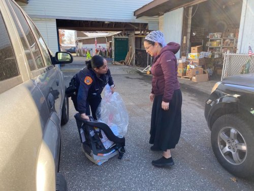 Suffolk Police and Partners Provide Car Seats, Coats, and Food to Families in Mastic