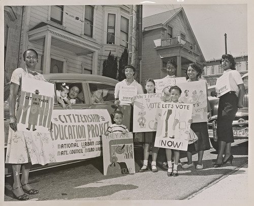 Photograph of women and children at voter registration motorcade