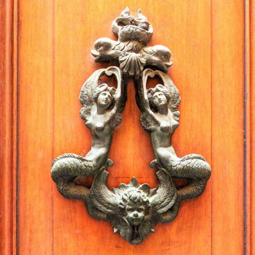 Italian Door Knockers: A Photo Tour of Bologna's Exquisite Entrances