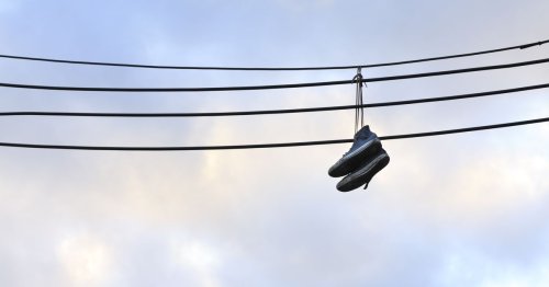 Do Sneakers Hanging from Power Lines Carry a Secret Message?